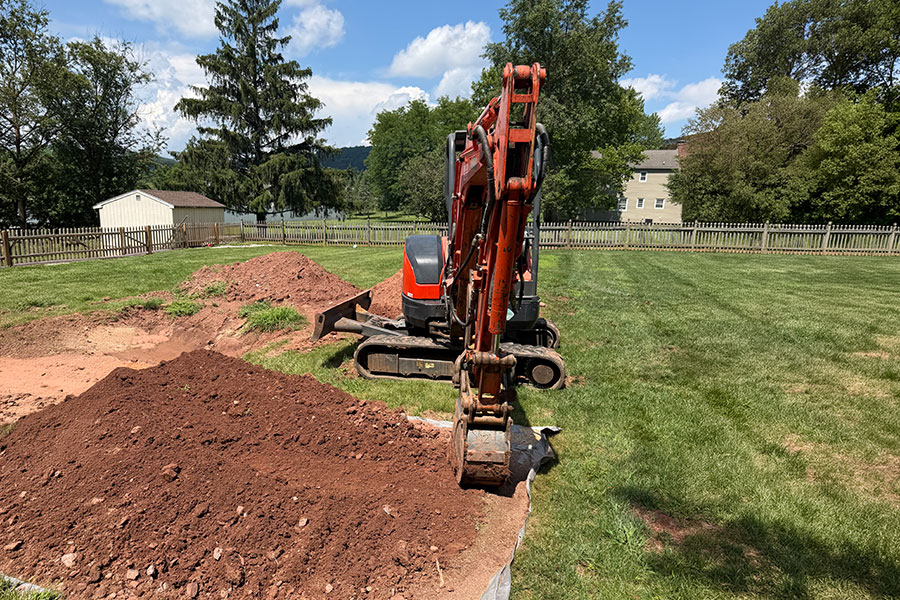 Titan Land Management equipment preparing site in Clinton NJ